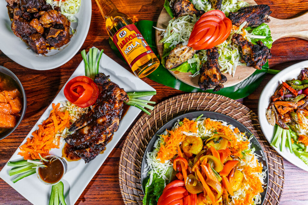 Jamaican food spread at Island Grill & Pub in Rock Hill, SC: oxtails, jerk chicken, curry and rice and peas
